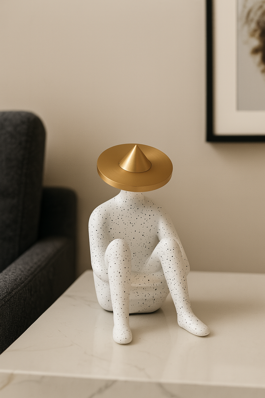 Speckled Clay Sitting Figurine with Gold Hat